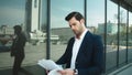 Closeup businessman studding documents. Business man throwing papers at street