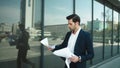 Closeup businessman studding documents. Business man throwing papers at street Royalty Free Stock Photo