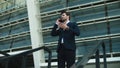 Closeup businessman talking phone outside. Businessman checking time on watch