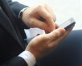 Closeup.businessman typing SMS on the smartphone