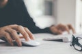 Closeup businessman using computer mouse with computer keyboard Royalty Free Stock Photo