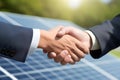 closeup businessmen handshake on solar panels background Royalty Free Stock Photo