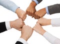 Closeup of businesspeople hands in fists in circle Royalty Free Stock Photo