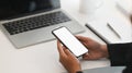 Closeup businesswoman holding her smartphone with empty screen. Royalty Free Stock Photo