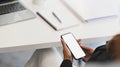 Closeup businesswoman holding her smartphone with empty screen. Royalty Free Stock Photo