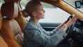 Closeup businesswoman punching steering wheel. Sad girl standing in traffic jam