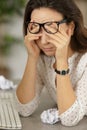 closeup businesswoman rubbing tired eyes with hands Royalty Free Stock Photo