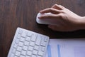 Closeup of Businesswoman`s hand holding a computer mouse. Technology in office Royalty Free Stock Photo