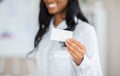 Closeup of businesswoman showing blank business card with mockup for design at modern office Royalty Free Stock Photo