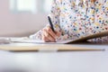 Closeup of businesswoman signing a document or contract Royalty Free Stock Photo