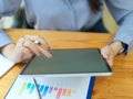 Closeup, businesswoman using tablet computer