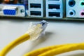 Closeup cable wire network connected to computer. Royalty Free Stock Photo