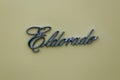 Closeup of the Cadillac Eldorado logo on a beige surface