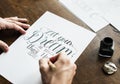 Closeup of a calligrapher working on a project