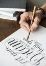 Closeup of a calligrapher working on a project Royalty Free Stock Photo