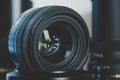 Closeup camera lens standing on a stand. Royalty Free Stock Photo