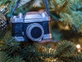 Closeup Camera ornament on Christmas tree.