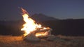 Close-up campfire in the mountains night