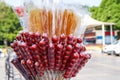 Closeup of candied haws sold by a street vendor