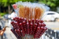 Closeup of candied haws sold by a street vendor