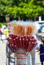 Closeup of candied haws sold by a street vendor