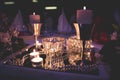 Closeup of candles, beads and other decorations at the table for the party