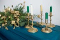 Closeup of candles and blurry Christmas garland Royalty Free Stock Photo