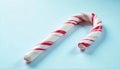 Closeup of a candy cane on a light blue background Royalty Free Stock Photo