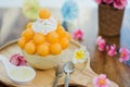 Closeup cantaloupe Bingsu on tray, Bingsu or Bingsoo, Korean shaved ice dessert with sweet toppings and fruit and varieties with