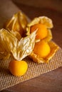 Closeup cape gooseberry on wooden table.