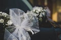 Closeup of a car decorated with beautiful wedding decorations Royalty Free Stock Photo