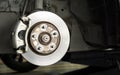 Closeup car disk brake maintenance service in car garage and copy spcae