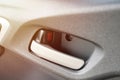 Closeup car door handle inside of hatchback city vehicle Royalty Free Stock Photo