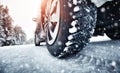 Closeup of car tires in winter on the road Royalty Free Stock Photo