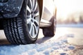 Closeup of car tires in winter on the road covered with snow Royalty Free Stock Photo