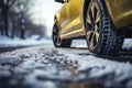 Closeup of car tires in winter on the road covered with snow