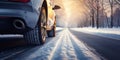 Closeup of car tires in winter on the road covered with snow Royalty Free Stock Photo