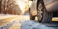 Closeup of car tires in winter on the road covered with snow Royalty Free Stock Photo