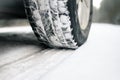 Closeup of car tires on a winter road covered with snow. Safe braking distance Royalty Free Stock Photo