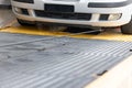 Closeup on car towed onto flatbed tow truck with cable Royalty Free Stock Photo