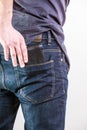 Closeup. Careless man taking wallet out on back pocket. Theft. Royalty Free Stock Photo