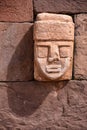 Closeup of a carved stone tenonv head embedded in wall of at the Tiwanaku UNESCO World Heritage Site near La Paz, Bolivia