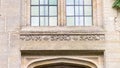 Closeup of carving above an entrance door at Nyman\'s House, National Trust property in West Sussex Royalty Free Stock Photo