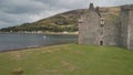 Closeup castle walls ruins at seascape aerial. Historic British palace of Hamilton dynasty on coast