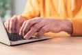 Closeup of casual adult caucasian male hands typing laptop computer keyboard Royalty Free Stock Photo