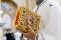 Closeup of catholic priest`s hands holding the Holy Bible Royalty Free Stock Photo