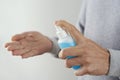 Man disinfecting his hands with hand sanitizer