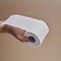 Man with a toilet paper roll in his hand