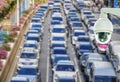 Closeup of CCTV security camera on abstract Blurred photo of traffic jam with rush hour on the road in the big city Royalty Free Stock Photo