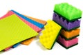 Cellulose sponge cloth and an organized stack of cleaning sponges, isolated on the white background, Closeup